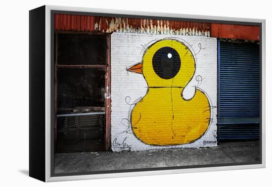 Yellow Duck on Brick Wall in Brooklyn NY-null-Framed Stretched Canvas