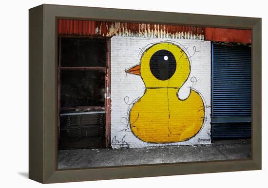 Yellow Duck on Brick Wall in Brooklyn NY-null-Framed Stretched Canvas