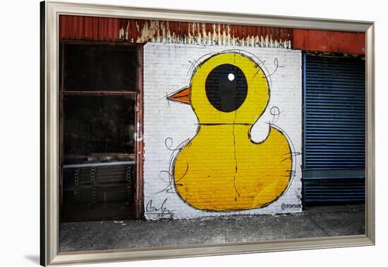 Yellow Duck on Brick Wall in Brooklyn NY-null-Framed Photo