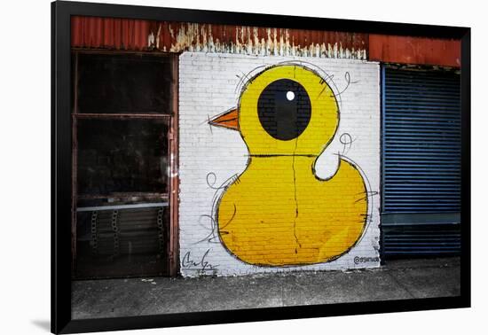 Yellow Duck on Brick Wall in Brooklyn NY-null-Framed Photo