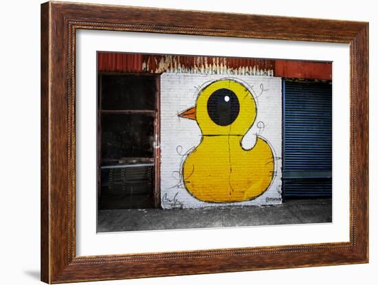 Yellow Duck on Brick Wall in Brooklyn NY-null-Framed Photo