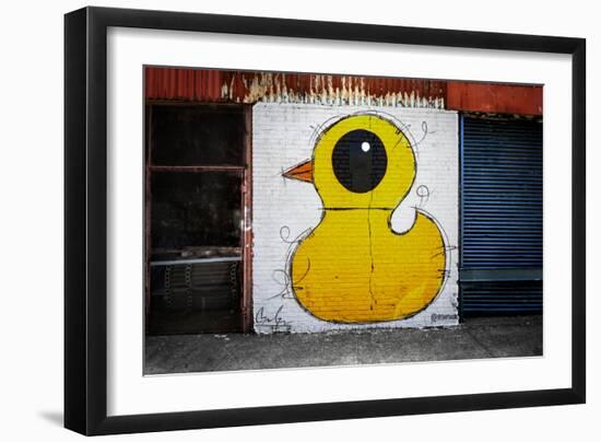 Yellow Duck on Brick Wall in Brooklyn NY-null-Framed Photo