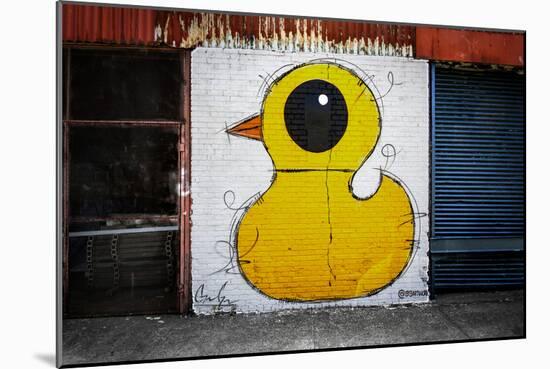 Yellow Duck on Brick Wall in Brooklyn NY-null-Mounted Photo