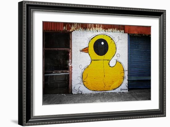 Yellow Duck on Brick Wall in Brooklyn NY-null-Framed Photo