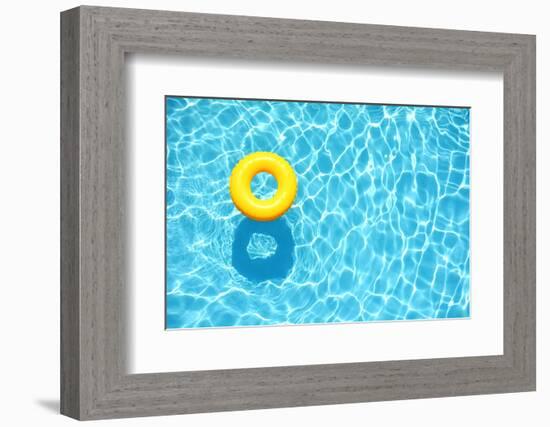 Yellow Pool Float, Ring Floating in a Refreshing Blue Swimming Pool-StacieStauffSmith Photos-Framed Photographic Print