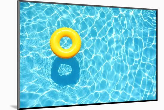 Yellow Pool Float, Ring Floating in a Refreshing Blue Swimming Pool-StacieStauffSmith Photos-Mounted Photographic Print