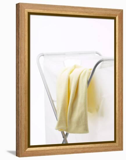 Yellow T-Shirt on Laundry Hamper-null-Framed Premier Image Canvas