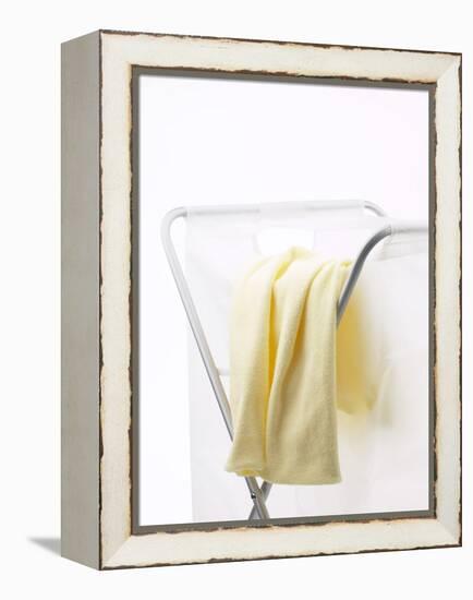 Yellow T-Shirt on Laundry Hamper-null-Framed Premier Image Canvas