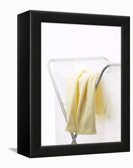 Yellow T-Shirt on Laundry Hamper-null-Framed Premier Image Canvas