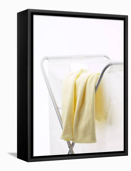 Yellow T-Shirt on Laundry Hamper-null-Framed Premier Image Canvas