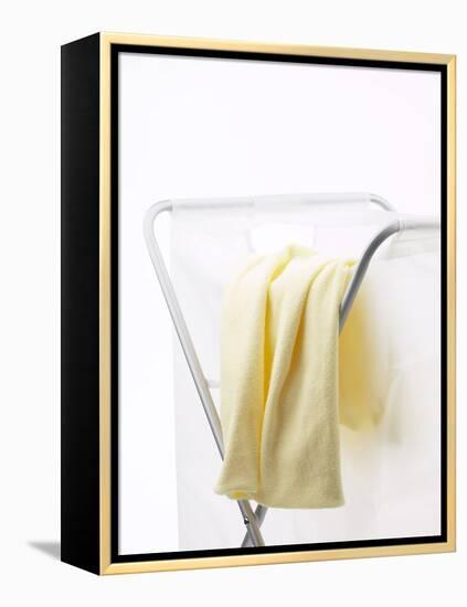 Yellow T-Shirt on Laundry Hamper-null-Framed Premier Image Canvas