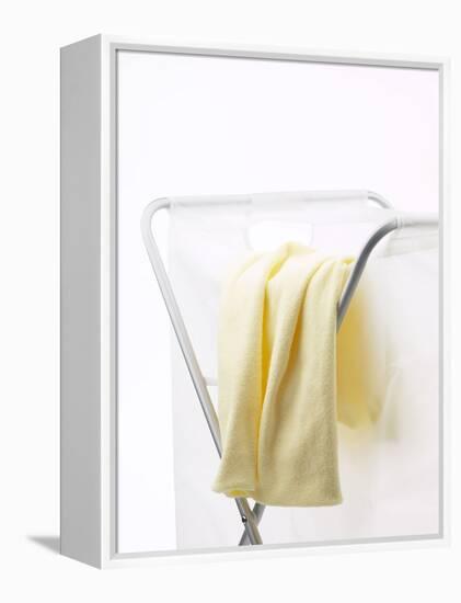 Yellow T-Shirt on Laundry Hamper-null-Framed Premier Image Canvas