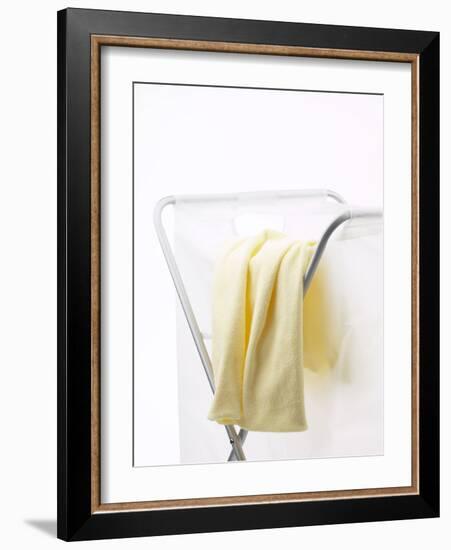 Yellow T-Shirt on Laundry Hamper-null-Framed Photographic Print