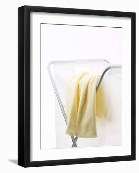 Yellow T-Shirt on Laundry Hamper-null-Framed Photographic Print