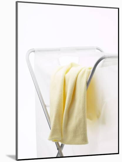 Yellow T-Shirt on Laundry Hamper-null-Mounted Photographic Print