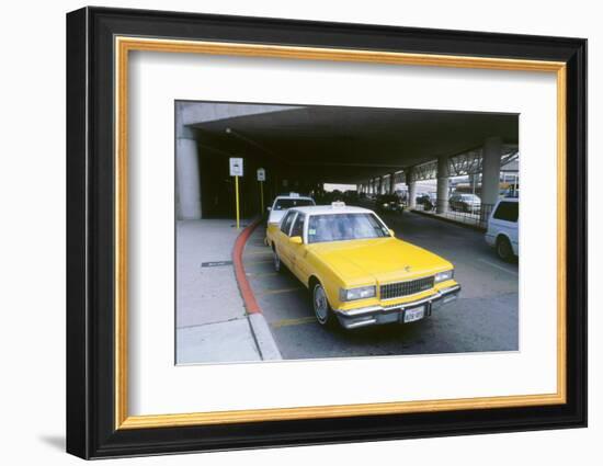 Yellow taxi cab at airport-null-Framed Photographic Print