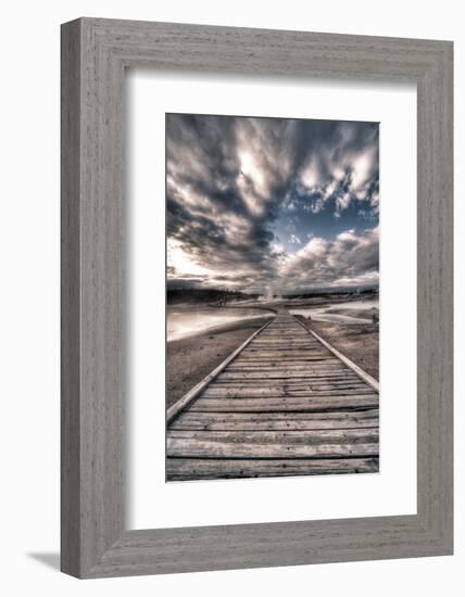 Yellowstone, Wyoming: a Wooden Path Going Through Norris Geyser Basin on a Cloudy Sunset-Brad Beck-Framed Photographic Print