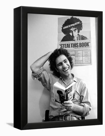 Yippie Leader Abbie Hoffman Holding Copy of His Book-John Shearer-Framed Premier Image Canvas