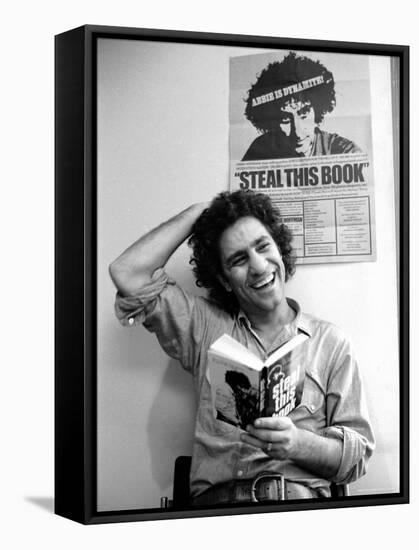 Yippie Leader Abbie Hoffman Holding Copy of His Book-John Shearer-Framed Premier Image Canvas