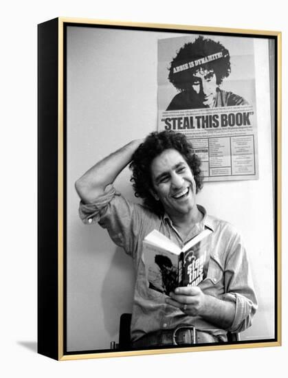 Yippie Leader Abbie Hoffman Holding Copy of His Book-John Shearer-Framed Premier Image Canvas