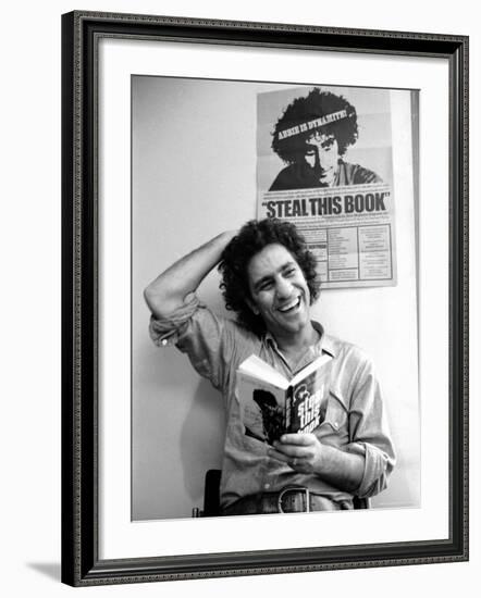 Yippie Leader Abbie Hoffman Holding Copy of His Book-John Shearer-Framed Premium Photographic Print