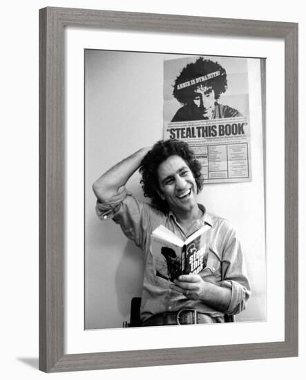 Yippie Leader Abbie Hoffman Holding Copy of His Book-John Shearer-Framed Premium Photographic Print