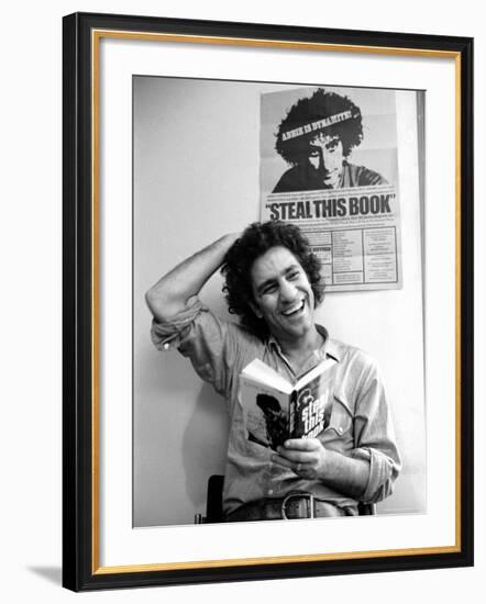 Yippie Leader Abbie Hoffman Holding Copy of His Book-John Shearer-Framed Premium Photographic Print