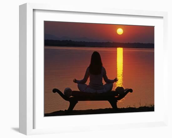 Yoga on a Saddle Bench Watching the Sun Go Down across the Zambesi River, Zambia-John Warburton-lee-Framed Photographic Print