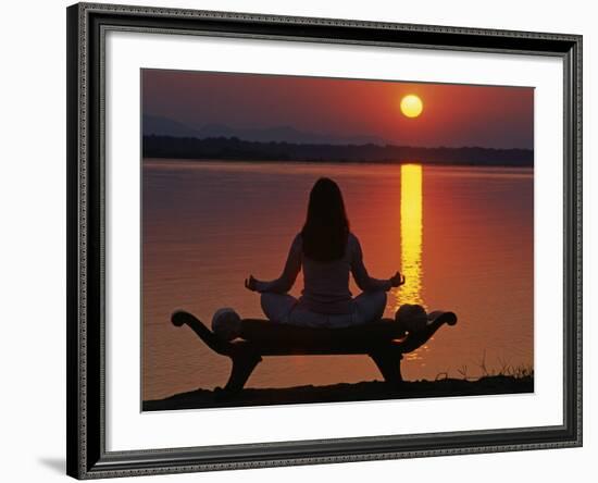 Yoga on a Saddle Bench Watching the Sun Go Down across the Zambesi River, Zambia-John Warburton-lee-Framed Photographic Print