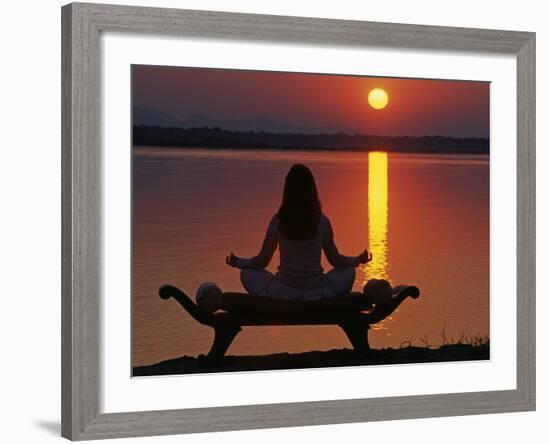 Yoga on a Saddle Bench Watching the Sun Go Down across the Zambesi River, Zambia-John Warburton-lee-Framed Photographic Print