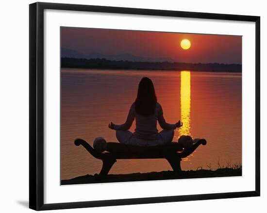 Yoga on a Saddle Bench Watching the Sun Go Down across the Zambesi River, Zambia-John Warburton-lee-Framed Photographic Print