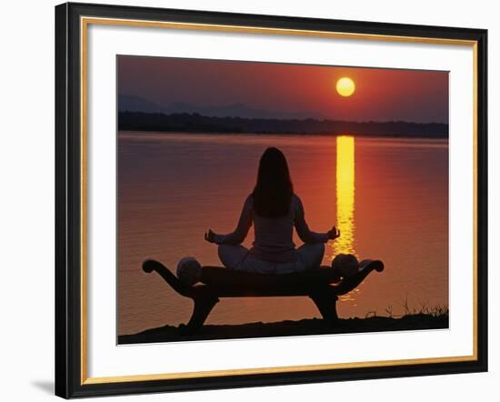 Yoga on a Saddle Bench Watching the Sun Go Down across the Zambesi River, Zambia-John Warburton-lee-Framed Photographic Print