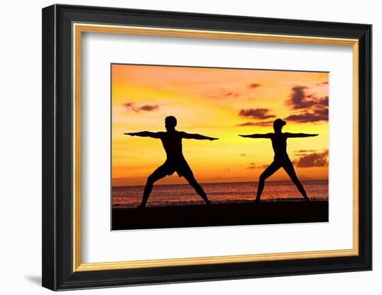 Yoga People Training and Meditating in Warrior Pose Outside by Beach at Sunrise or Sunset-Maridav-Framed Photographic Print