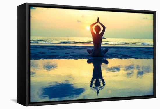 Yoga Woman Sitting In Lotus Pose On The Beach During Sunset-De Visu-Framed Stretched Canvas