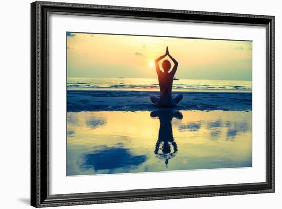 Yoga Woman Sitting In Lotus Pose On The Beach During Sunset-De Visu-Framed Art Print