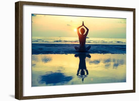 Yoga Woman Sitting In Lotus Pose On The Beach During Sunset-De Visu-Framed Art Print