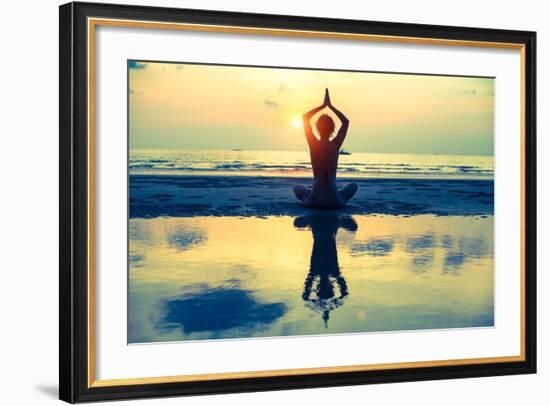 Yoga Woman Sitting In Lotus Pose On The Beach During Sunset-De Visu-Framed Art Print