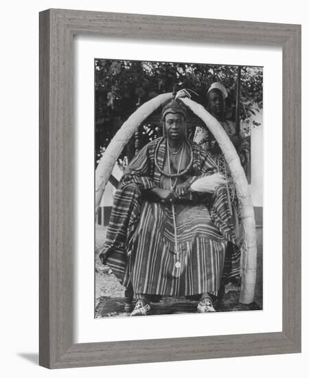 Yoruba Tribal Ruler in West Nigeria on Throne Surrounded by Elephant Tusks-null-Framed Photographic Print