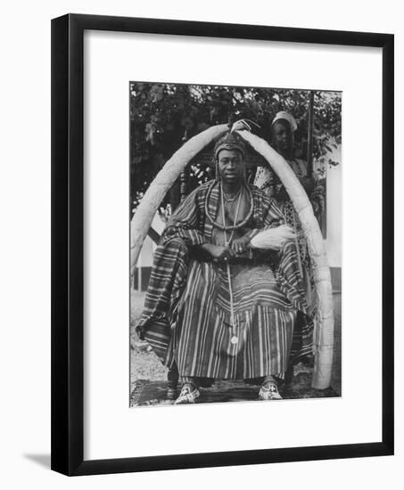 Yoruba Tribal Ruler in West Nigeria on Throne Surrounded by Elephant Tusks-null-Framed Photographic Print