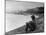 Young African American Boy Sitting on Memphis Riverbank Watching Boats on the Mississippi River-Ed Clark-Mounted Photographic Print