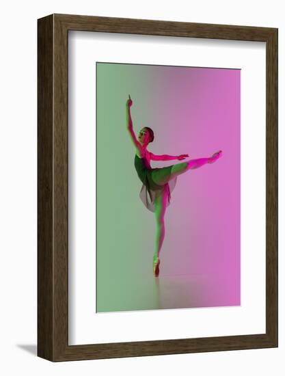 Young and Graceful Ballet Dancer Isolated on Gradient Pink-Green Studio Background in Neon Light. A-master1305-Framed Photographic Print