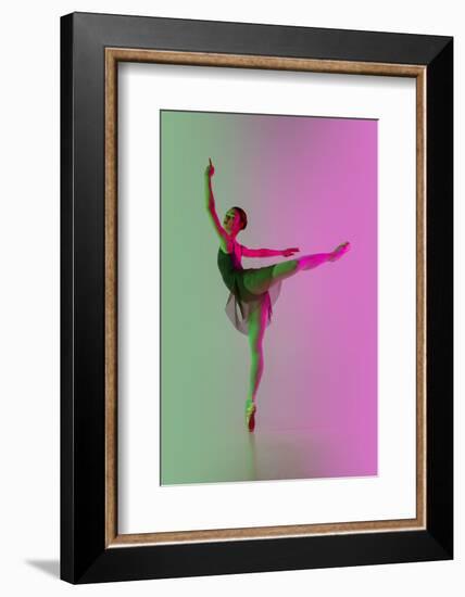 Young and Graceful Ballet Dancer Isolated on Gradient Pink-Green Studio Background in Neon Light. A-master1305-Framed Photographic Print