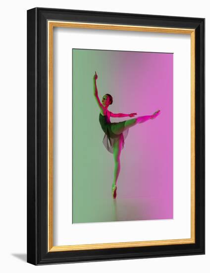 Young and Graceful Ballet Dancer Isolated on Gradient Pink-Green Studio Background in Neon Light. A-master1305-Framed Photographic Print