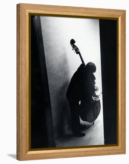 Young Bassist Member of Alexander Schneider's New York String Orchestra Tuning His Instrument-Gjon Mili-Framed Premier Image Canvas