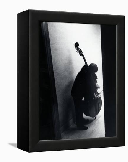 Young Bassist Member of Alexander Schneider's New York String Orchestra Tuning His Instrument-Gjon Mili-Framed Premier Image Canvas