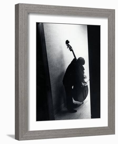 Young Bassist Member of Alexander Schneider's New York String Orchestra Tuning His Instrument-Gjon Mili-Framed Photographic Print