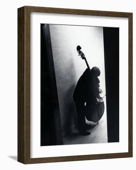 Young Bassist Member of Alexander Schneider's New York String Orchestra Tuning His Instrument-Gjon Mili-Framed Photographic Print