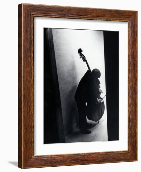 Young Bassist Member of Alexander Schneider's New York String Orchestra Tuning His Instrument-Gjon Mili-Framed Photographic Print