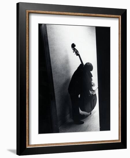 Young Bassist Member of Alexander Schneider's New York String Orchestra Tuning His Instrument-Gjon Mili-Framed Photographic Print