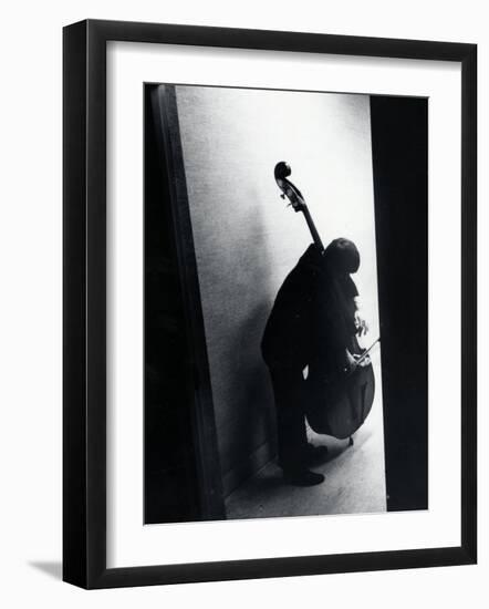 Young Bassist Member of Alexander Schneider's New York String Orchestra Tuning His Instrument-Gjon Mili-Framed Photographic Print